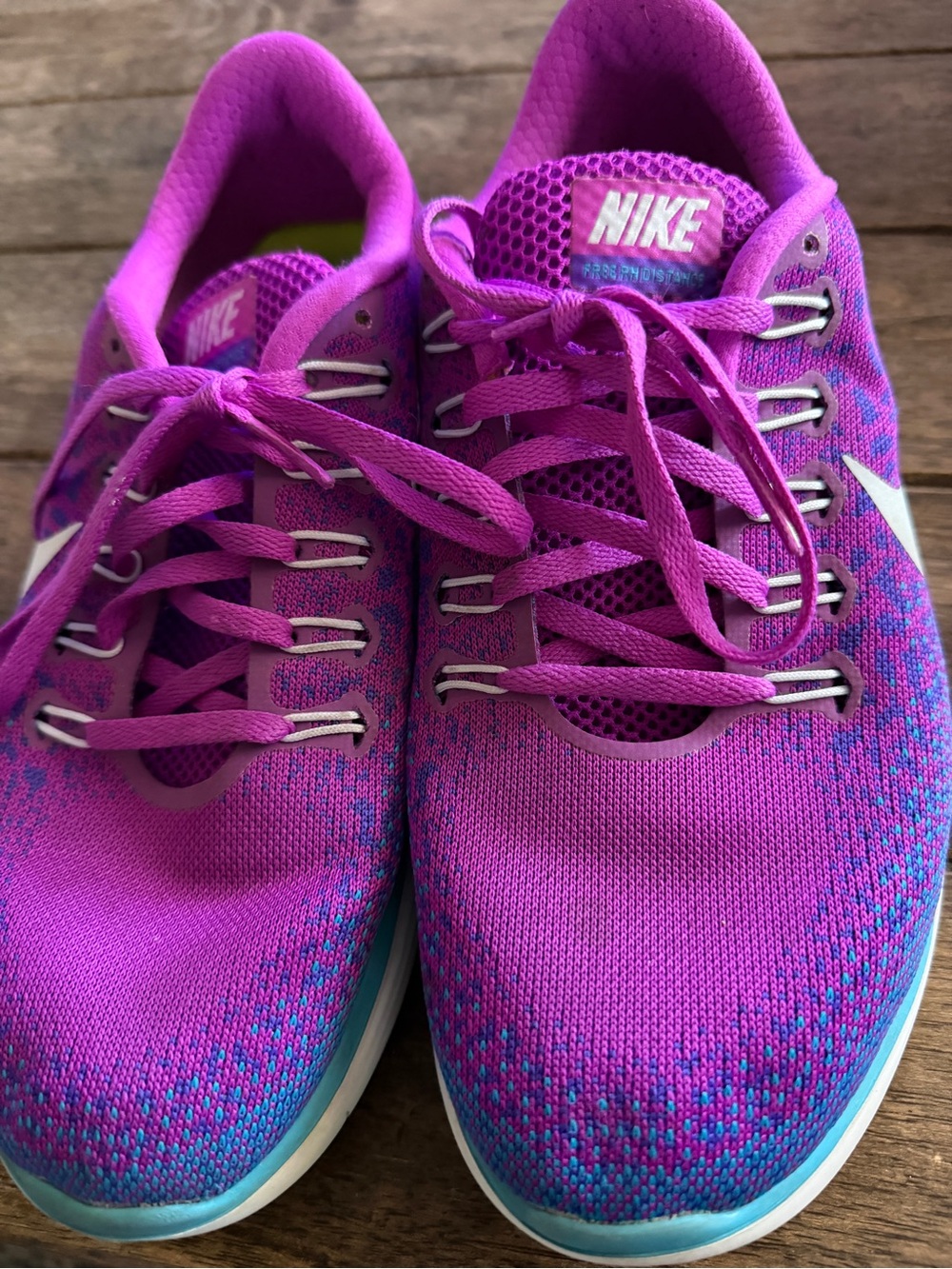Nike Women's Vibrant Purple-Pink Athletic Shoes with Blue Accents